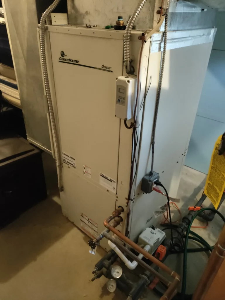 Indoor geothermal heat pump unit with water connections