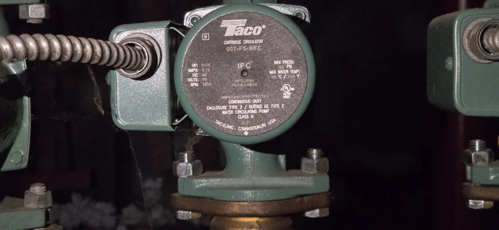 Boiler circulator pump and flanges on hydronic piping