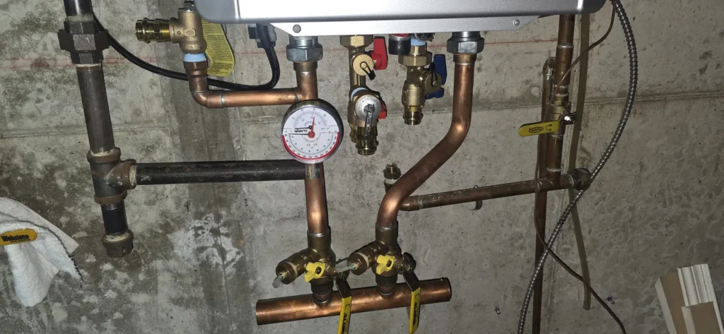 Boiler supply piping with pressure gauge and valves