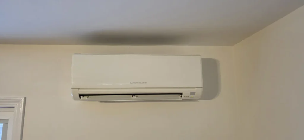 Ductless mini-split indoor unit in a bedroom