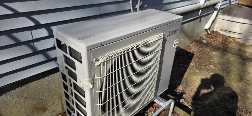 Mini-split outdoor unit mounted on a bracket