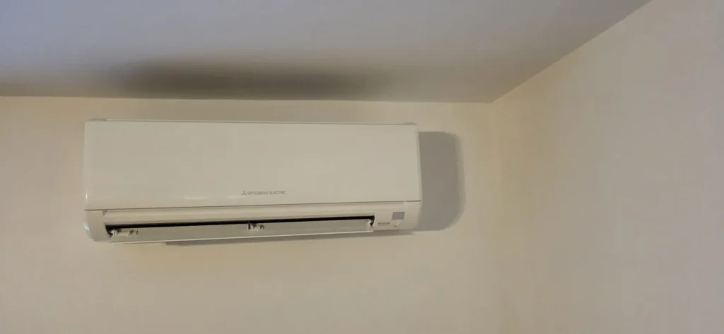 Ductless mini-split indoor unit on a light wall