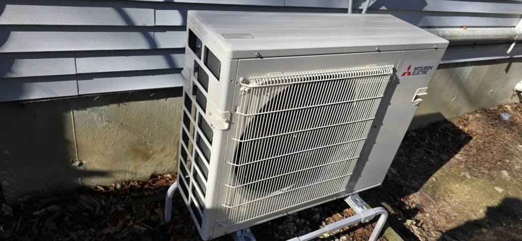 Ductless mini-split outdoor unit on a wall bracket