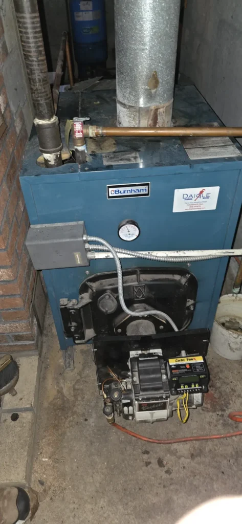 Oil-fired boiler with burner in a basement