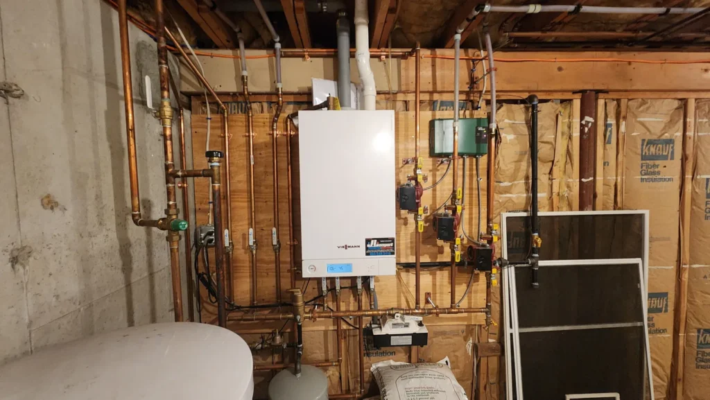 Wall-hung high-efficiency boiler installation with neat piping