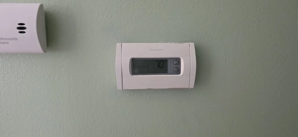 Digital wall thermostat used to control central air conditioning