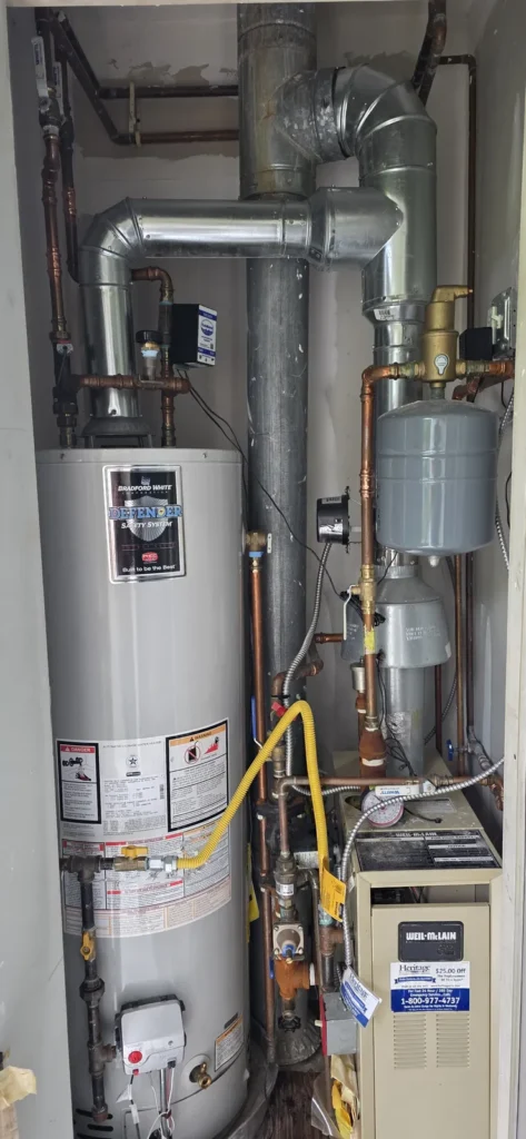 Water heater replacement with new gas piping and venting